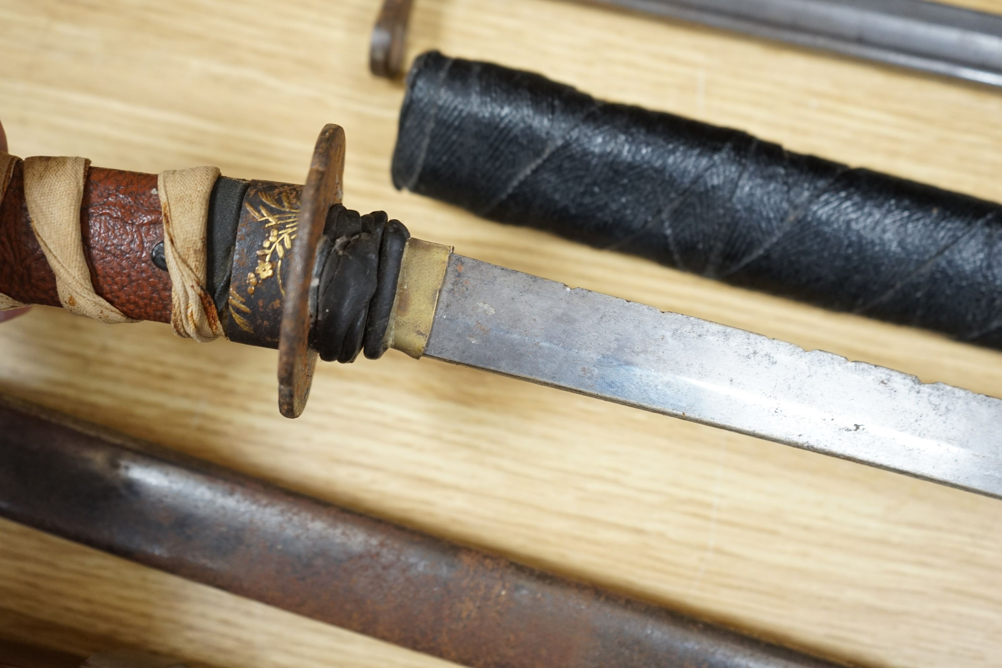 A Japanese wakizashi, a WWI bayonet and a Continental sword, sword 94cms long
